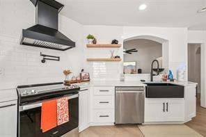198 Celestial Run Winder, GA 30680 - Photo 5 of 30 a kitchen with stainless steel appliances a stove a sink and a microwave