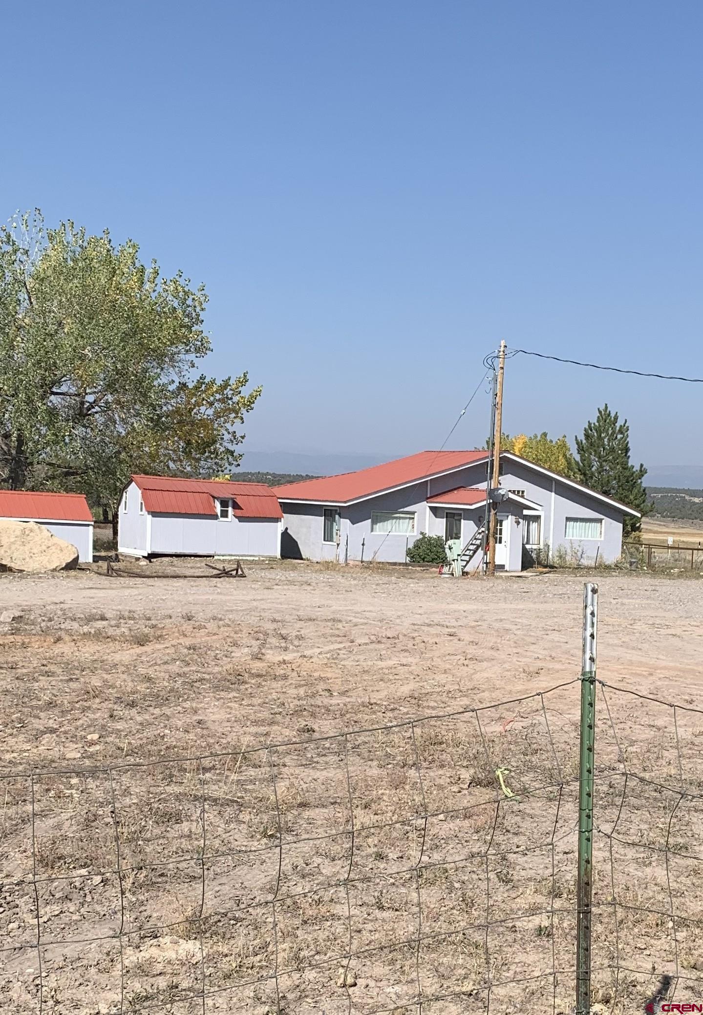 a tall building with trees in front of it
