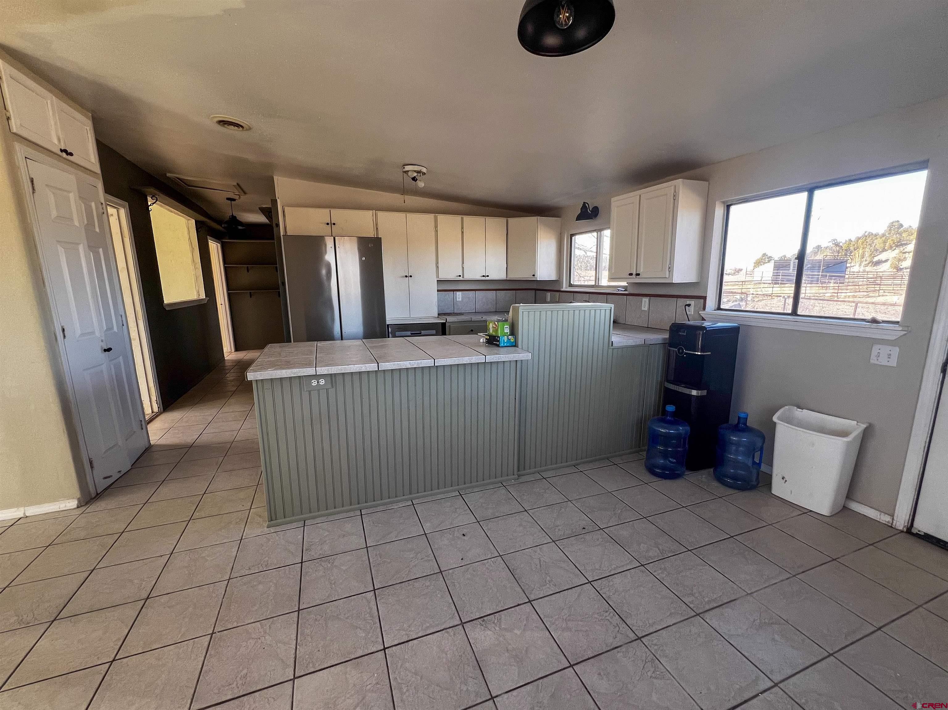 3350 County Road 319 Ignacio, CO 81137 - Photo 9 of 14 a kitchen with refrigerator and window