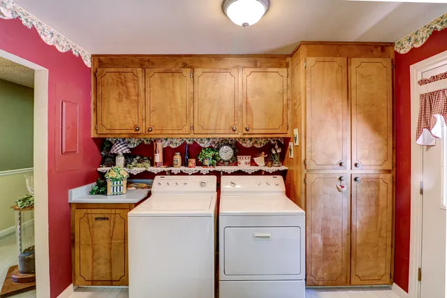 a kitchen with a stove a refrigerator and a dining table