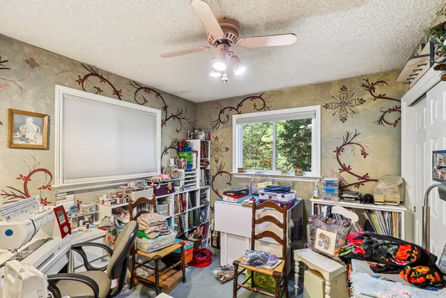 a bedroom with furniture and a window