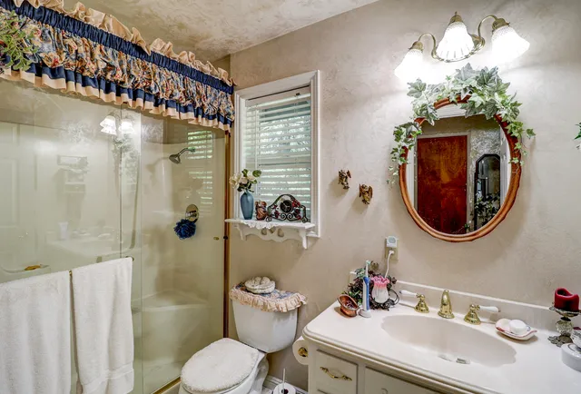 a view of a house with a tree in the background