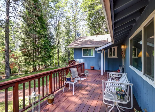 a backyard of a house with yard and tree s