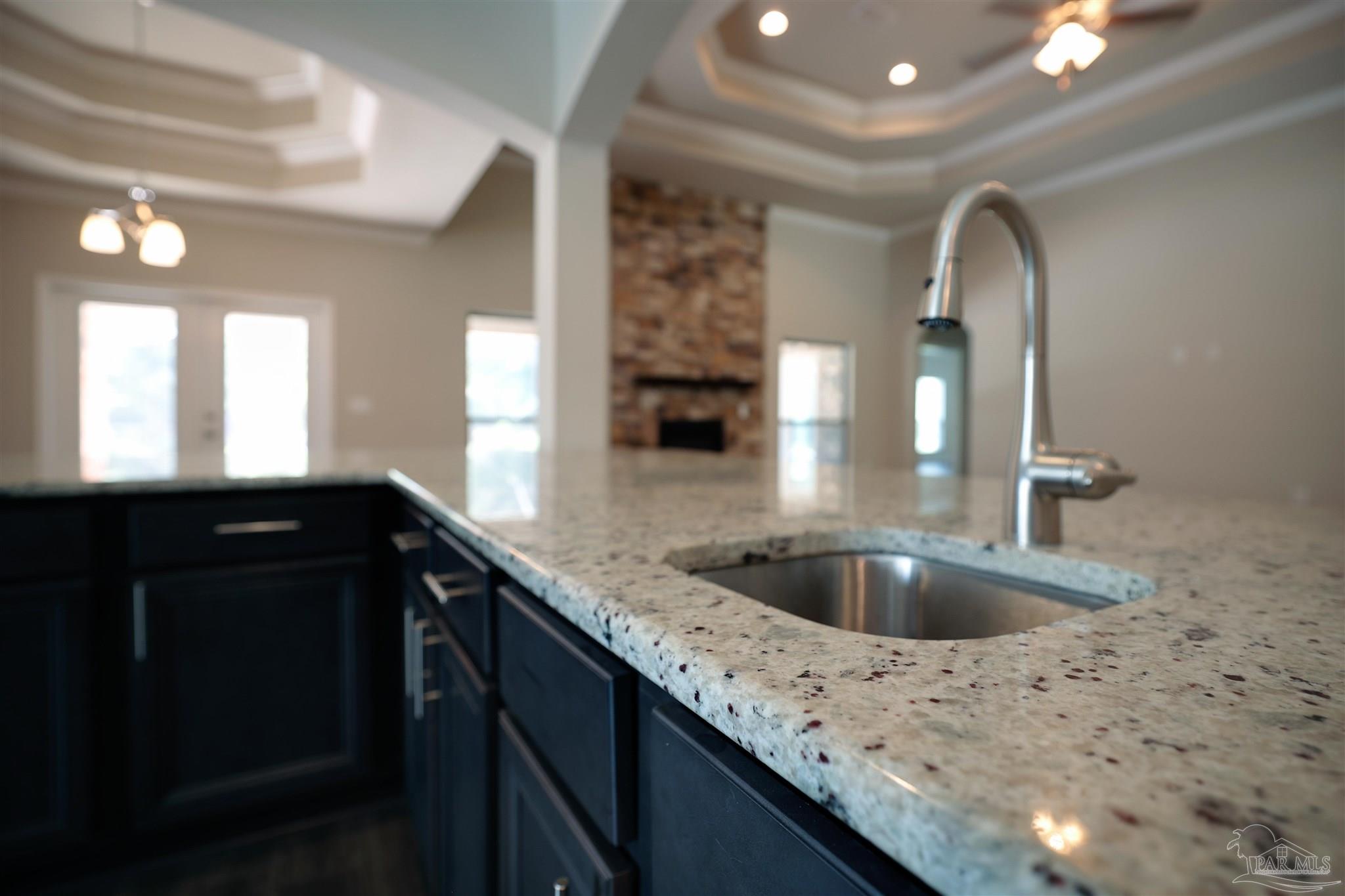 5847 Mossy Creek Lane Pace, FL 32571 - Photo 14 of 50 a kitchen with a sink and a mirror