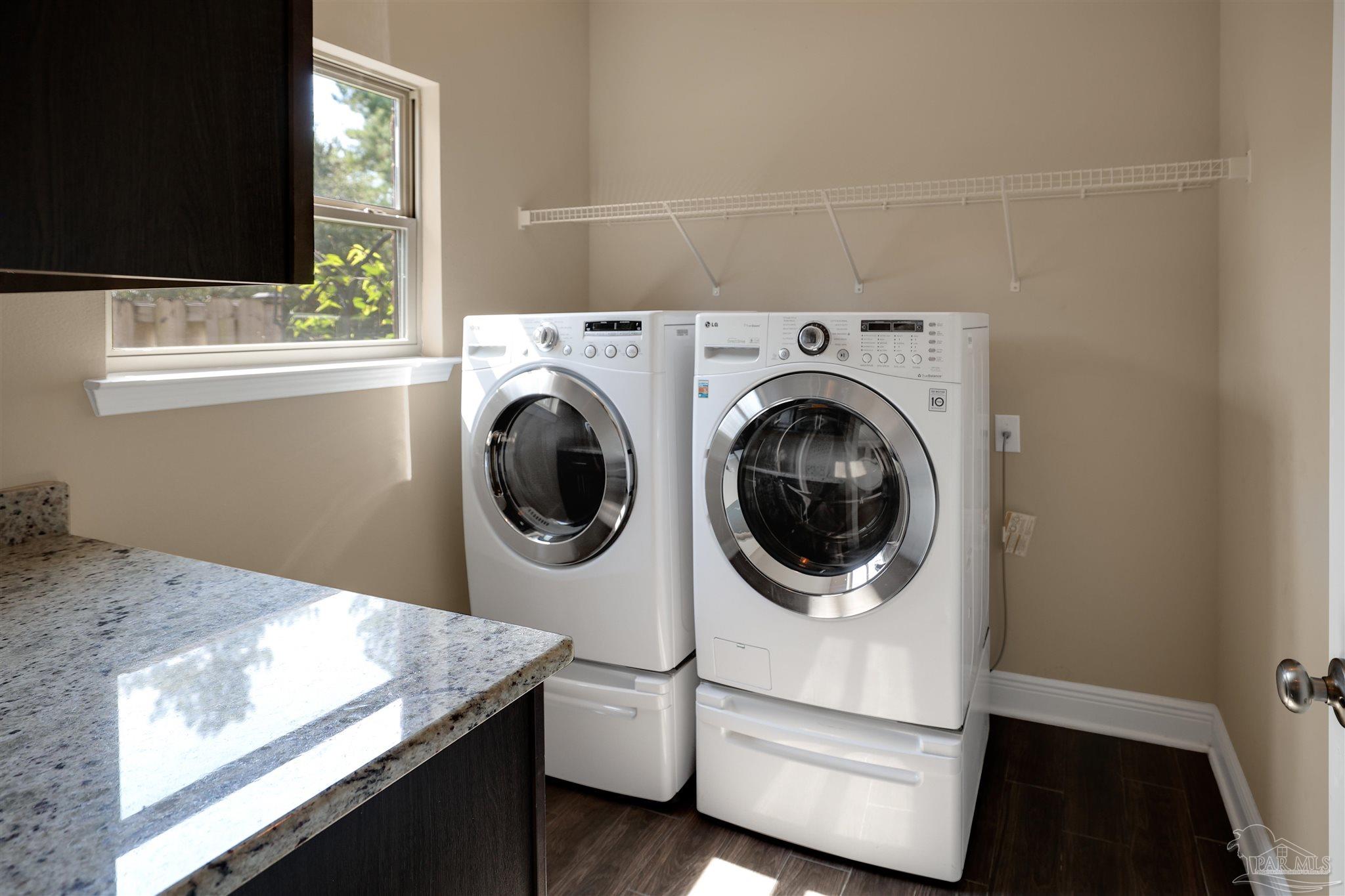 5847 Mossy Creek Lane Pace, FL 32571 - Photo 15 of 50 a utility room with dryer and washer