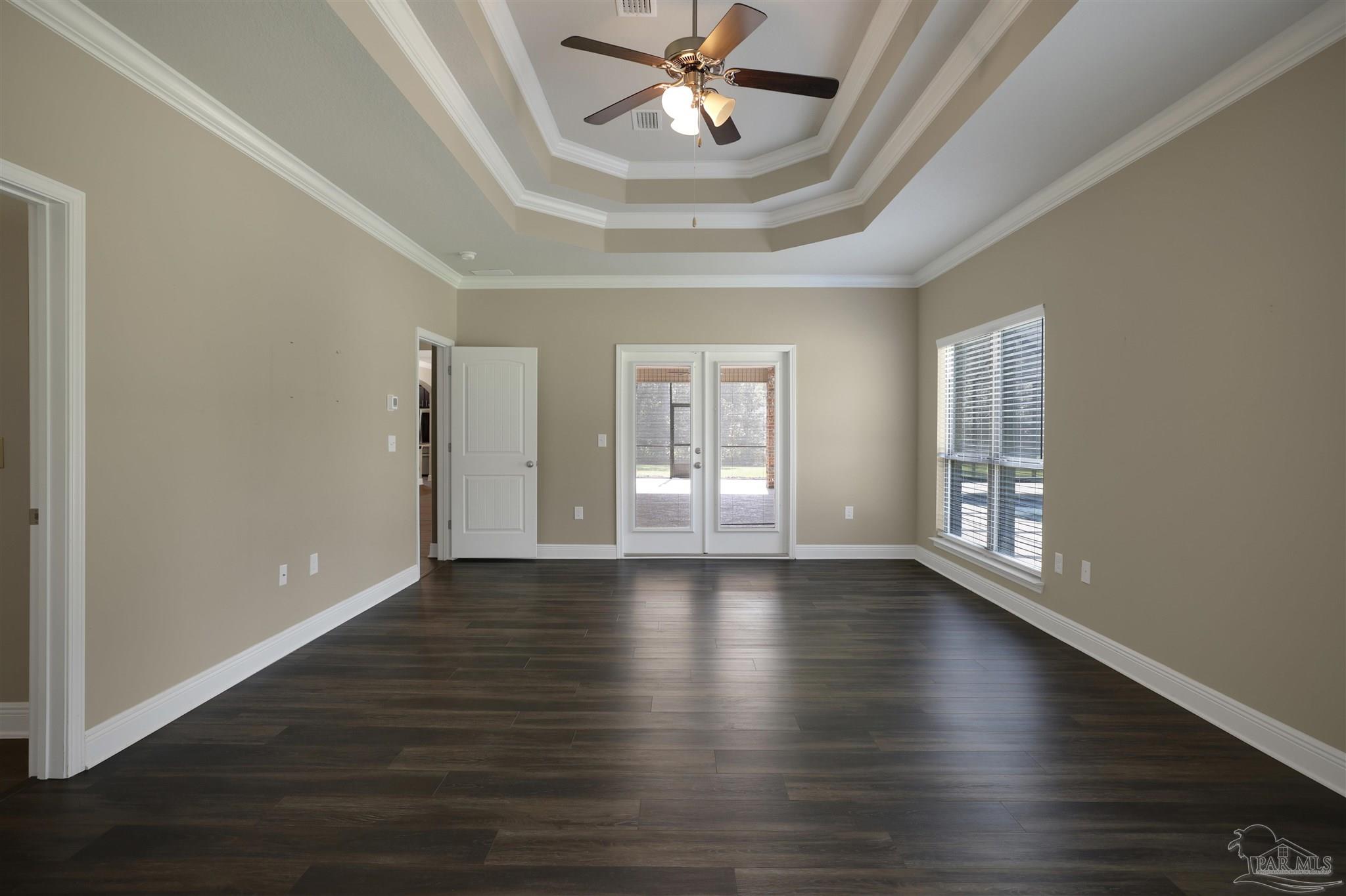 5847 Mossy Creek Lane Pace, FL 32571 - Photo 17 of 50 a view of an empty room with wooden floor and a window