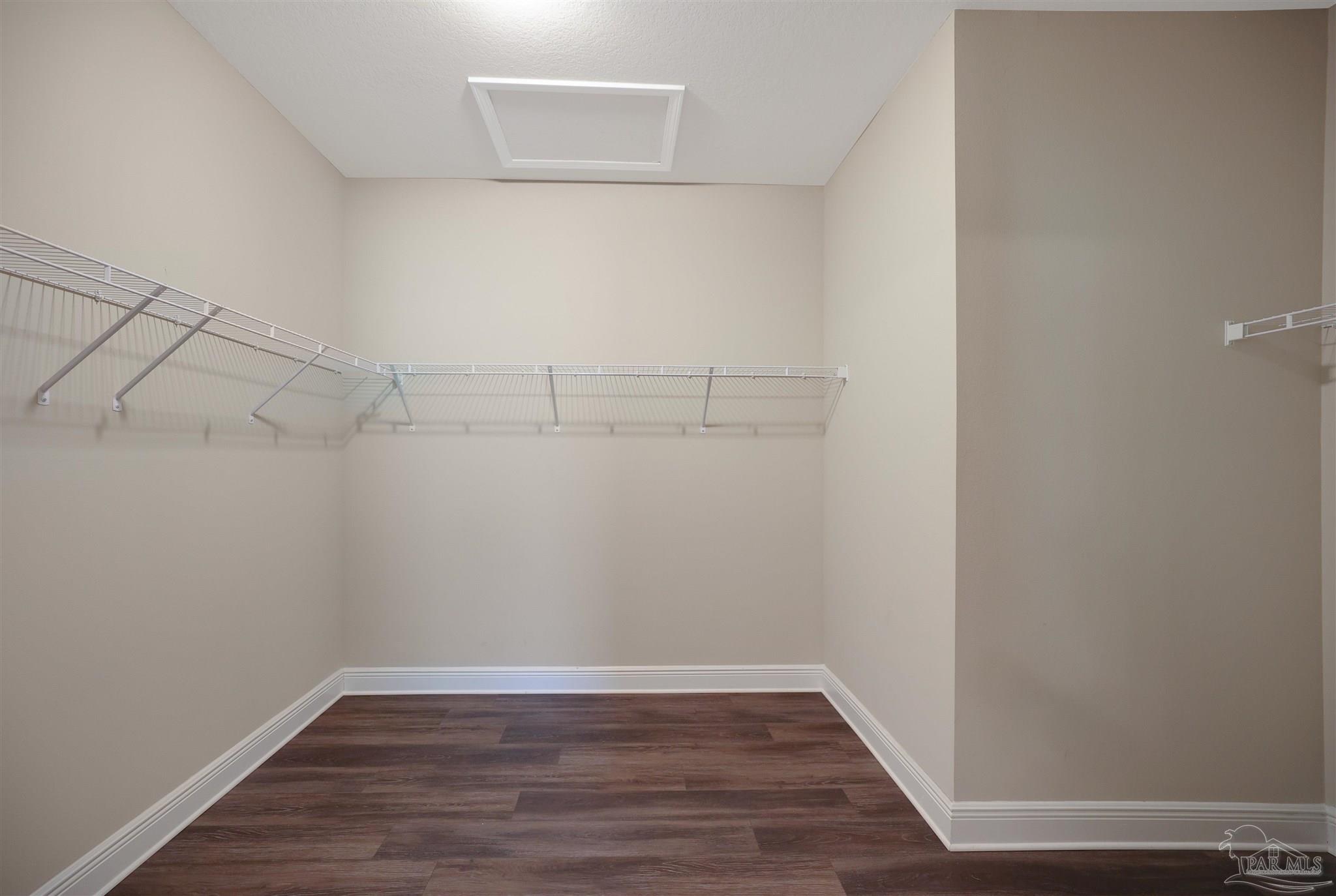 5847 Mossy Creek Lane Pace, FL 32571 - Photo 21 of 50 a view of a room with wooden floor
