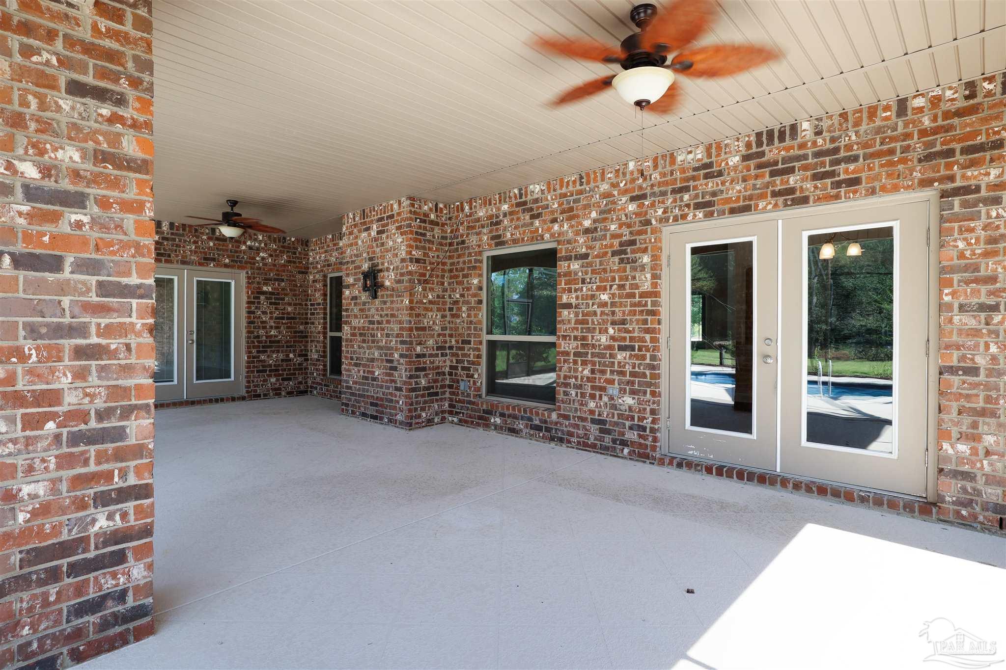 5847 Mossy Creek Lane Pace, FL 32571 - Photo 35 of 50 a view of a house with a ceiling fan and a window