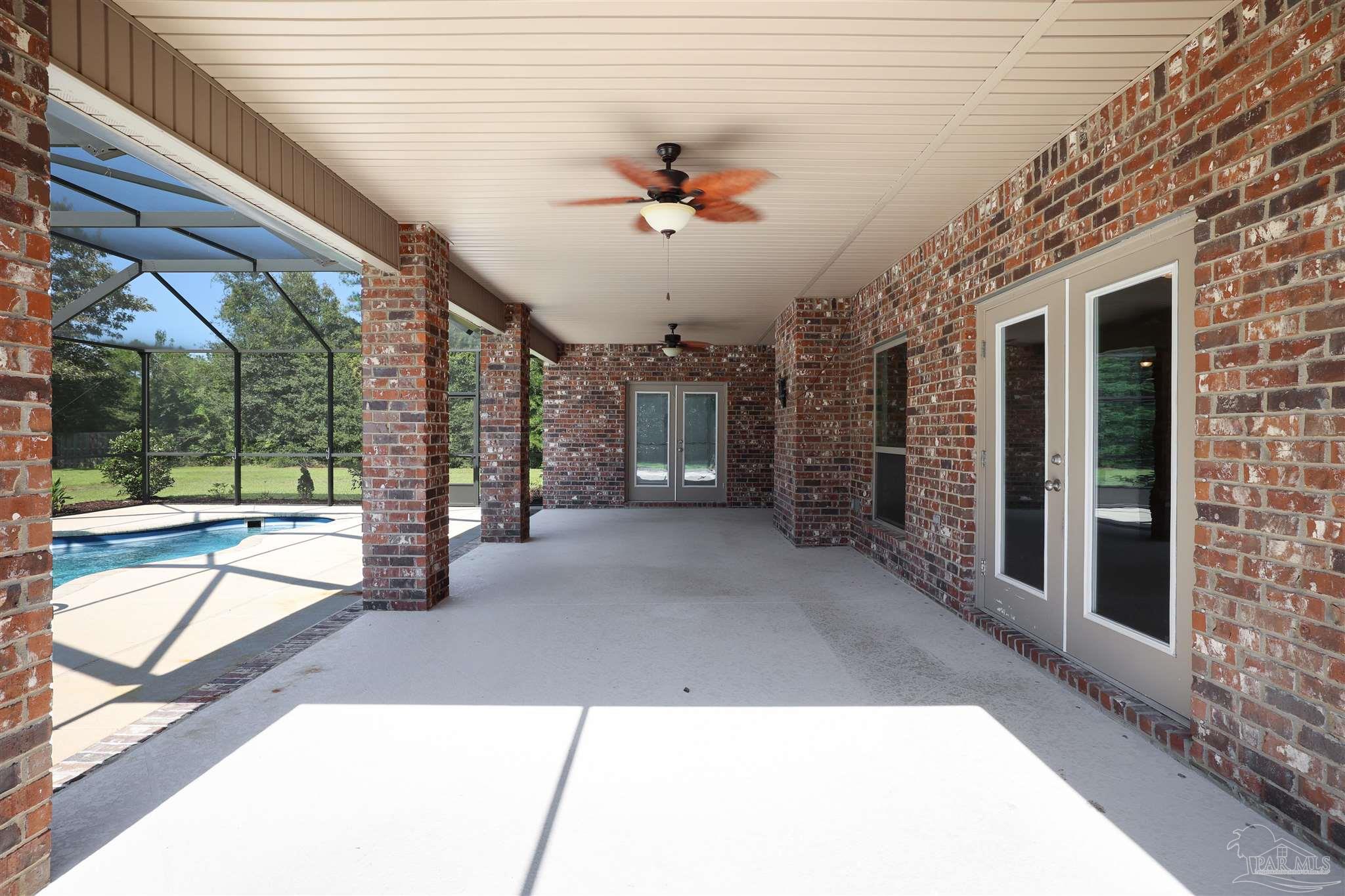 5847 Mossy Creek Lane Pace, FL 32571 - Photo 36 of 50 a view interior of the house with a floor to ceiling window and wooden floor