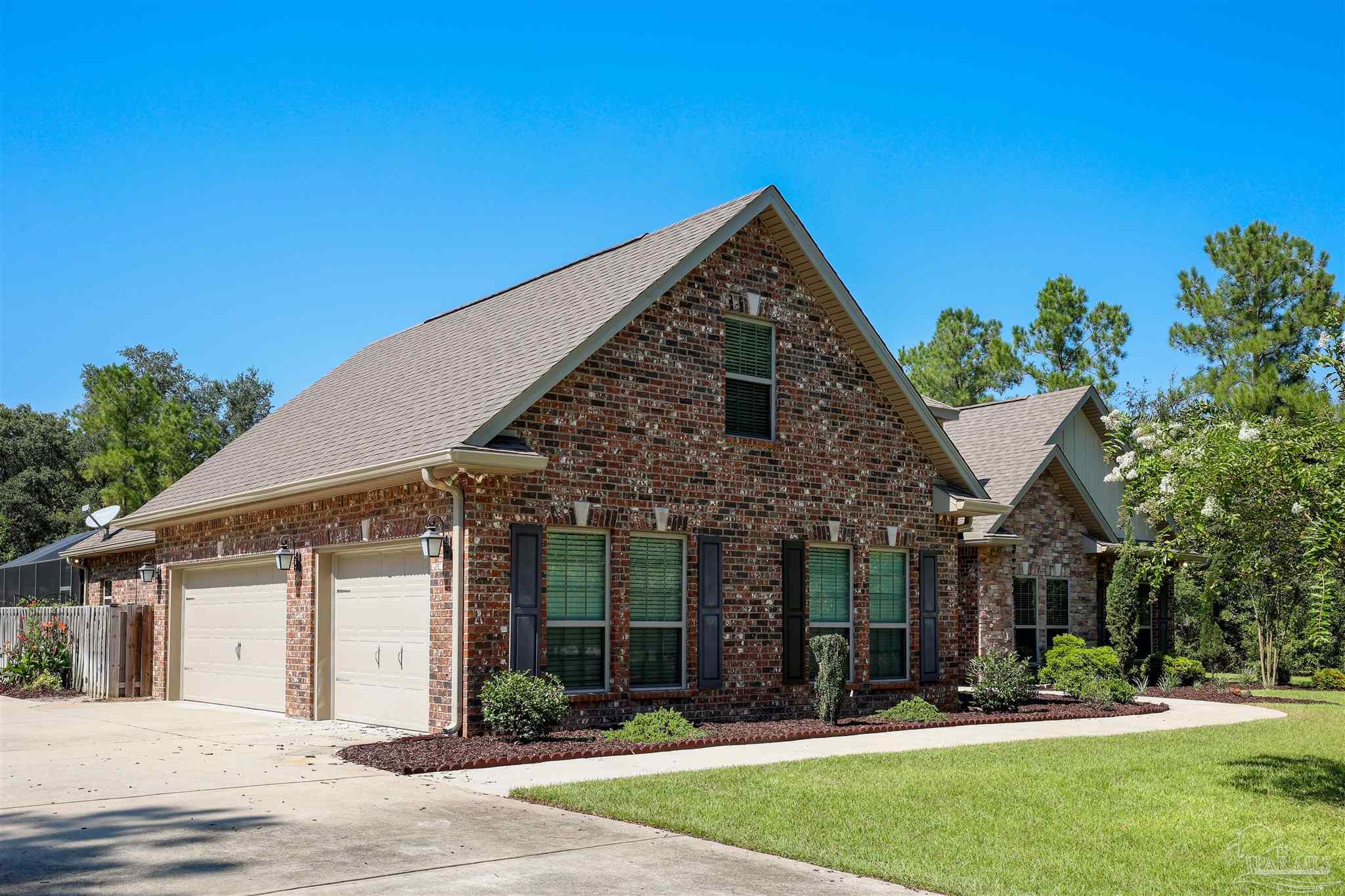 5847 Mossy Creek Lane Pace, FL 32571 - Photo 41 of 50 front view of a house with a yard