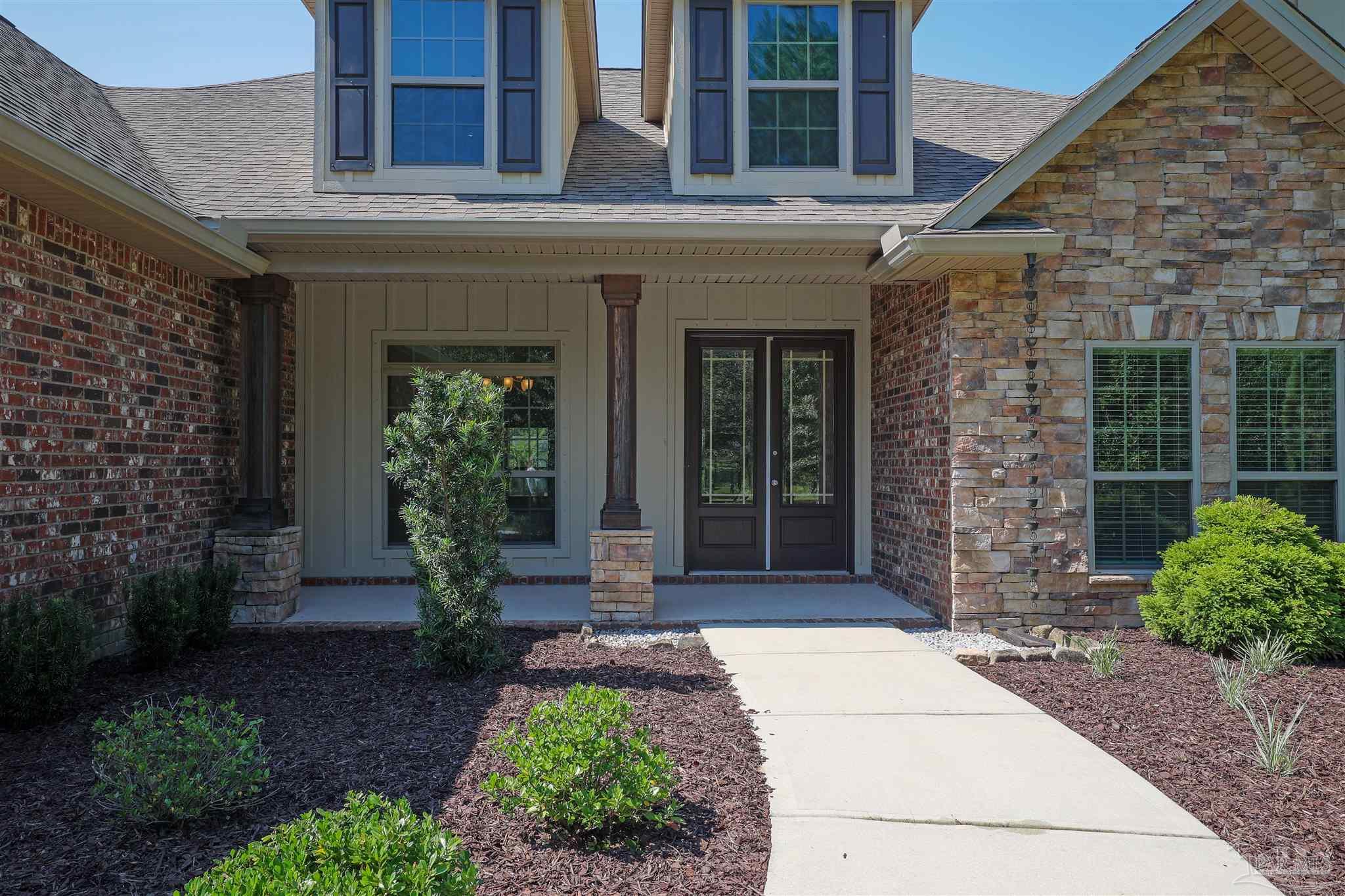 5847 Mossy Creek Lane Pace, FL 32571 - Photo 42 of 50 a front view of a house