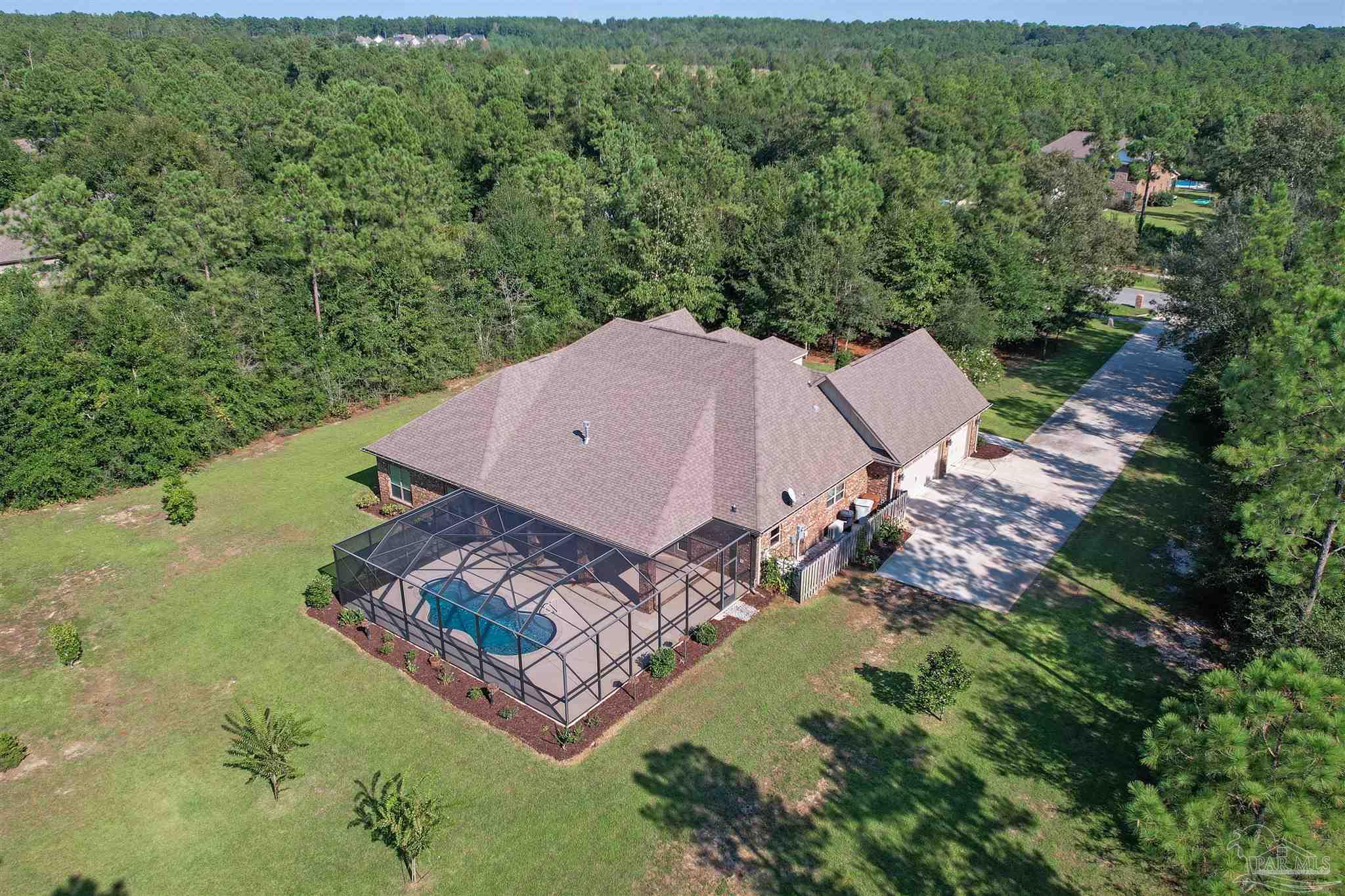 5847 Mossy Creek Lane Pace, FL 32571 - Photo 48 of 50 an aerial view of a house with garden space and street view