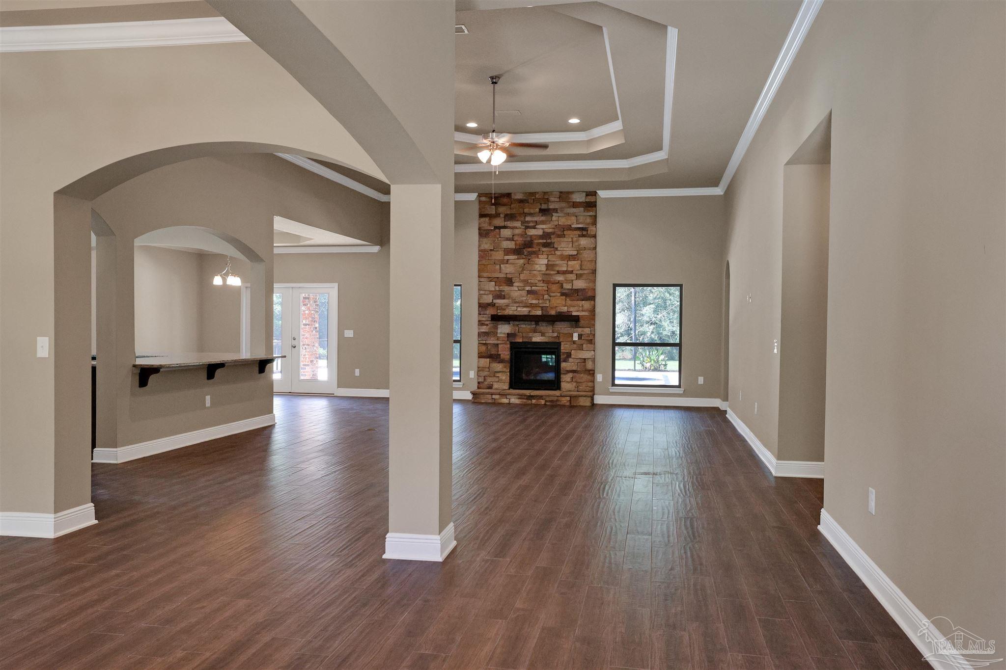 5847 Mossy Creek Lane Pace, FL 32571 - Photo 6 of 50 a view of livingroom with hardwood floor and a ceiling fan