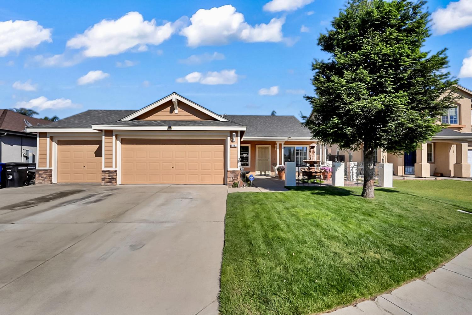 a front view of a house with garden