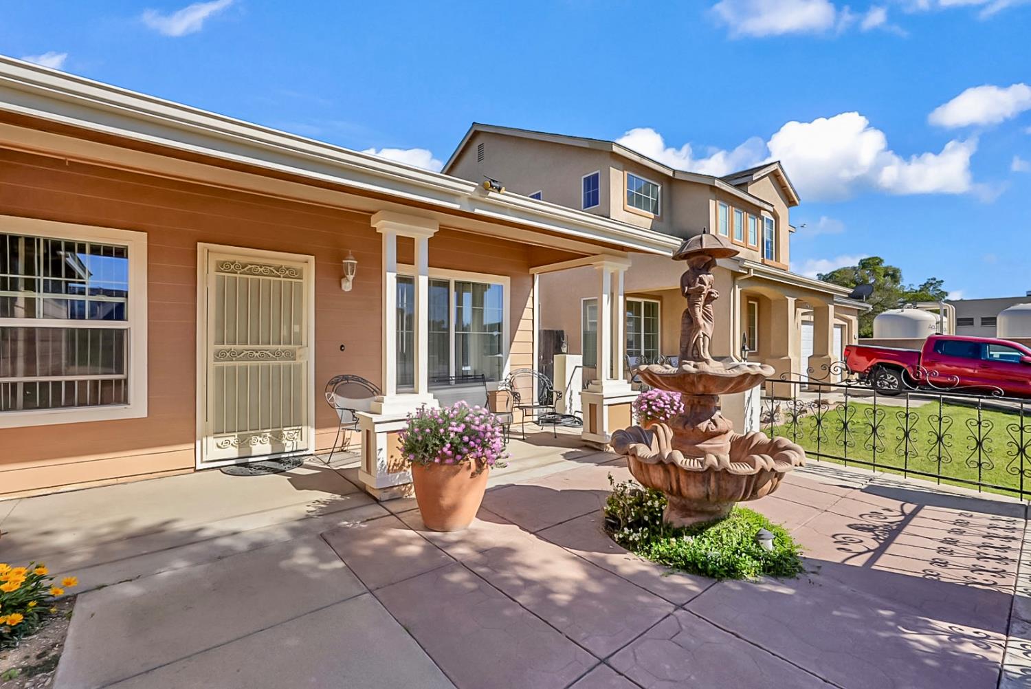 5432 Roselena Way Keyes, CA 95328 - Photo 3 of 16 a front view of a house with outdoor seating