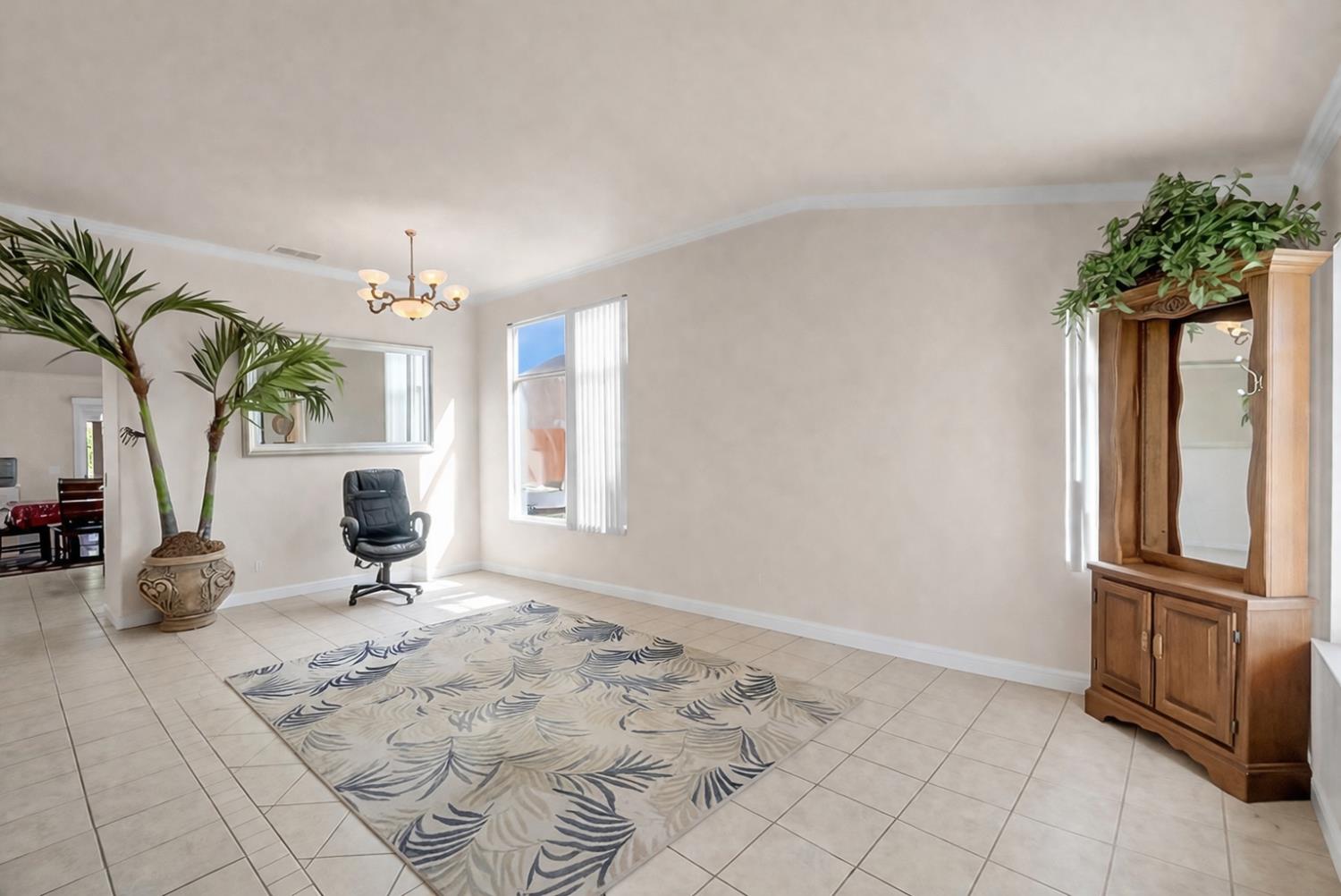 5432 Roselena Way Keyes, CA 95328 - Photo 5 of 16 a view of a livingroom with furniture and a window