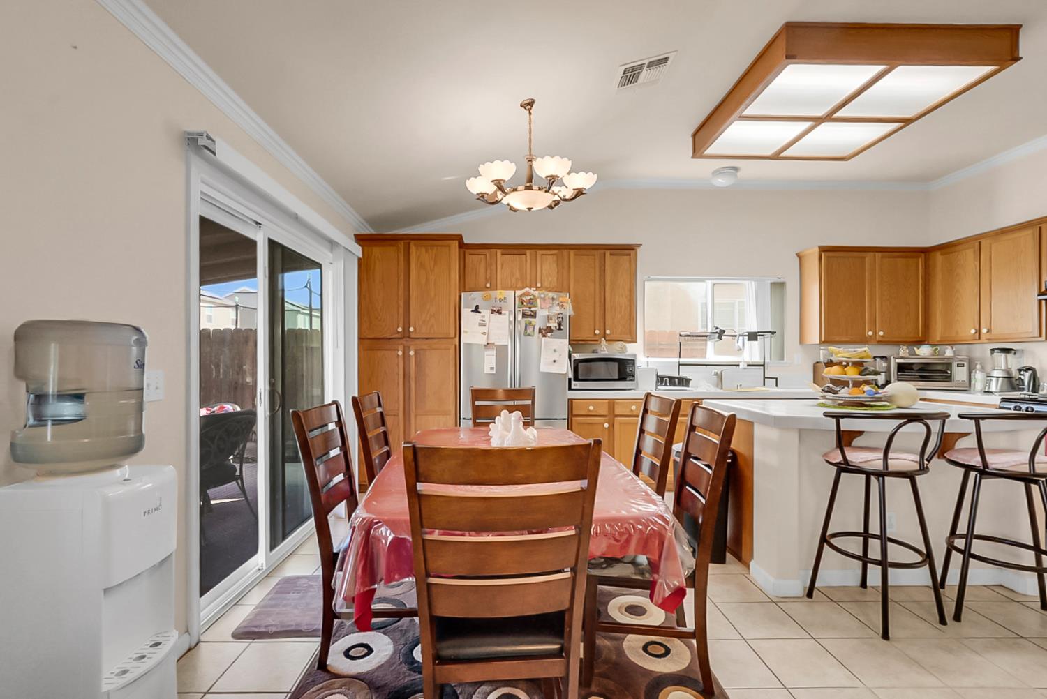 5432 Roselena Way Keyes, CA 95328 - Photo 8 of 16 a view of a dining room with furniture window and outside view