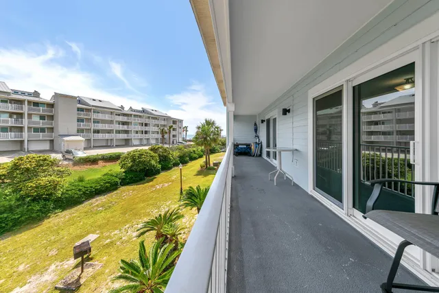 a view of balcony with furniture