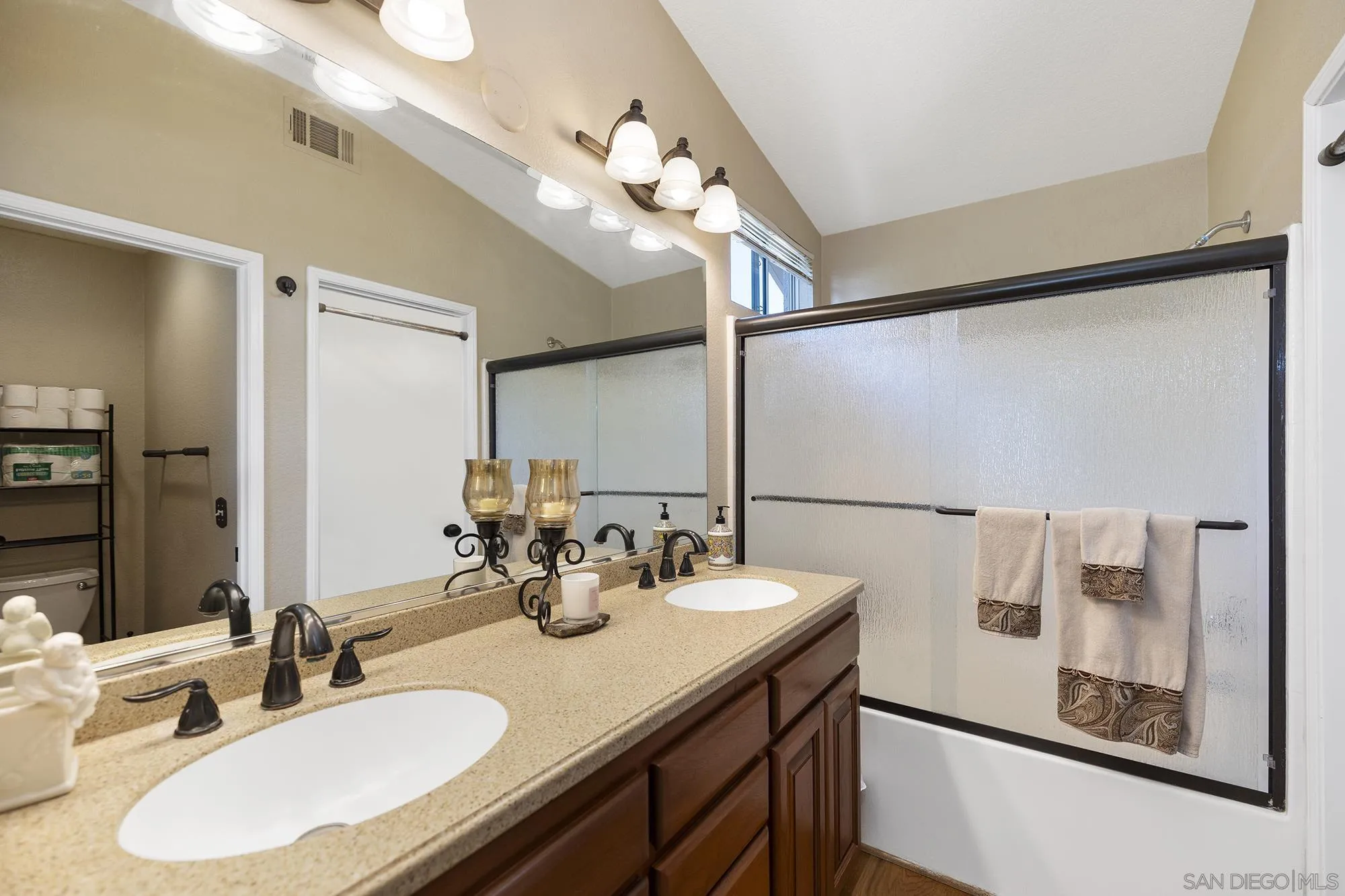 31450 Corte Rimola Temecula, CA 92592 - Photo 15 of 31 a bathroom with a sink double vanity and a mirror