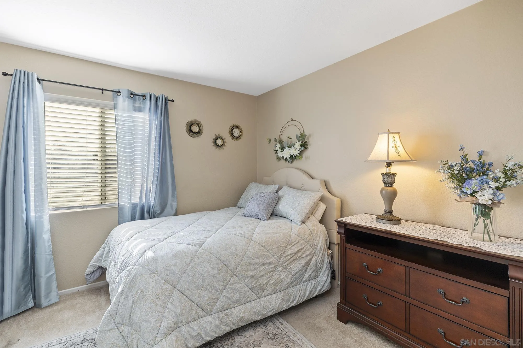 31450 Corte Rimola Temecula, CA 92592 - Photo 16 of 31 a bedroom with a bed and a potted plant