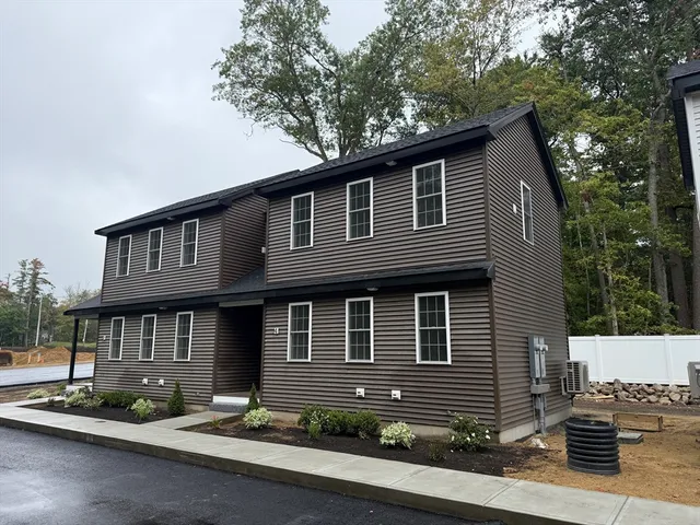 a front view of a house with garage