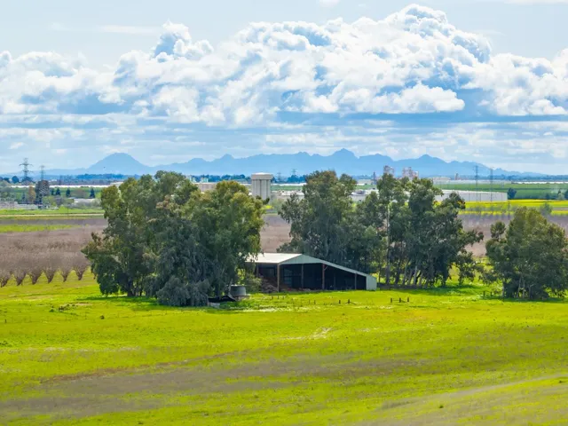 a view of a lake with a big yard