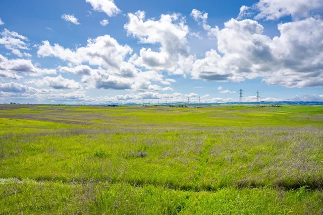 a view of an ocean and a building in the background