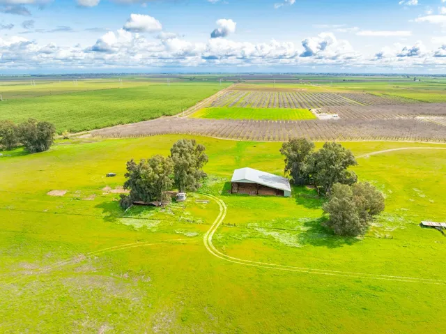 a front view of a building and ocean view