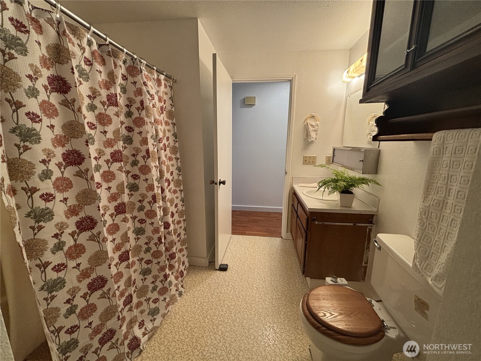7265 East Harrison Street, Unit A Port Orchard, WA 98366 - Photo 11 of 17 a bathroom with a sink toilet and shower