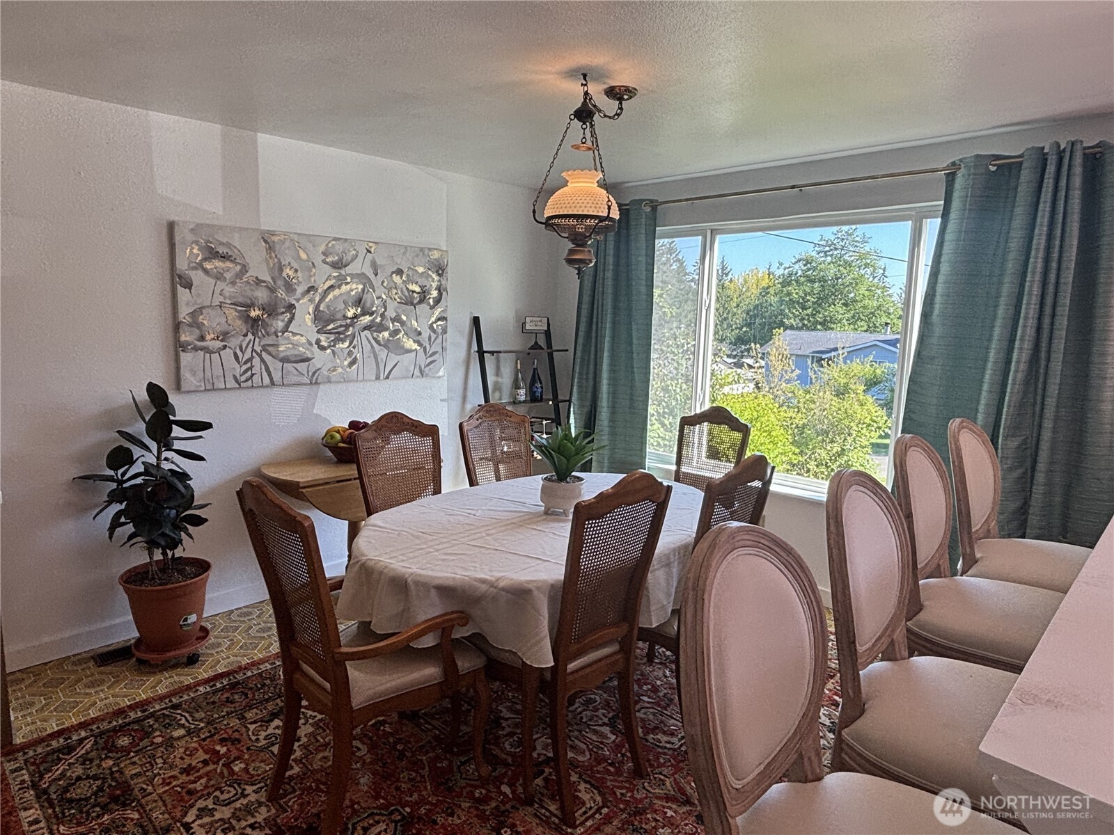 7265 East Harrison Street, Unit A Port Orchard, WA 98366 - Photo 3 of 17 a view of a dining room with furniture window and outside view