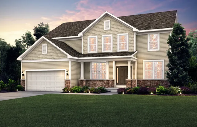 a front view of a house with a garden and plants