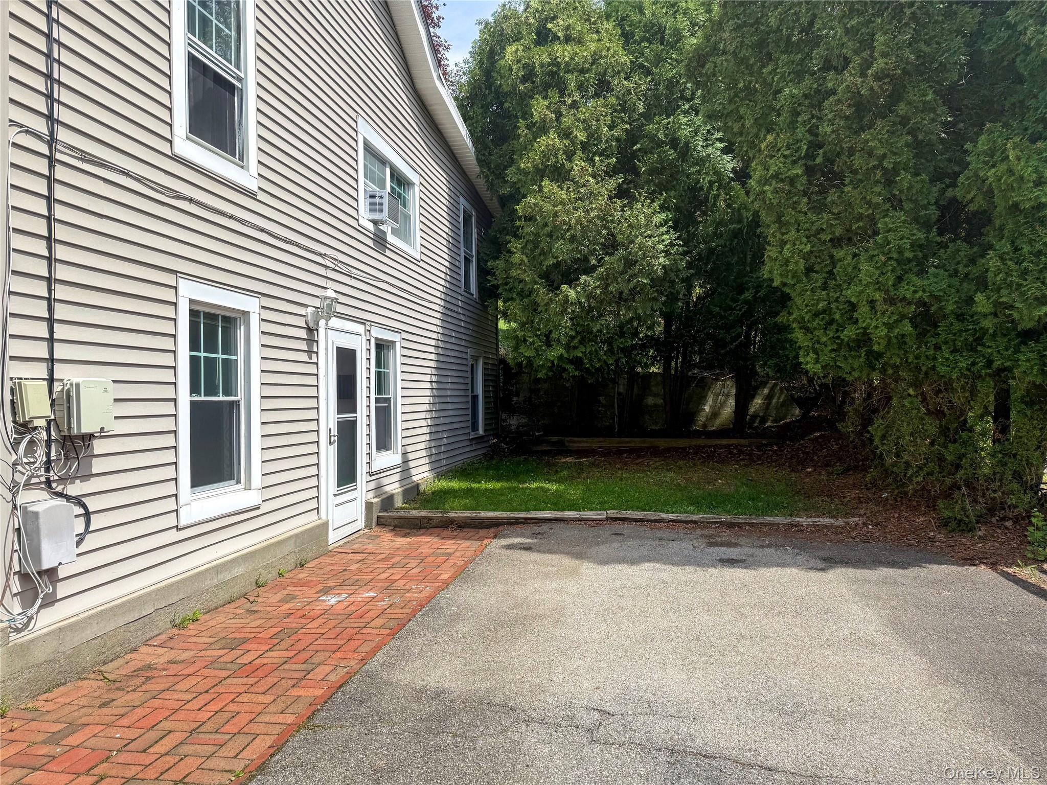 504 Highway 9D, Unit C Beacon, NY 12508 - Photo 1 of 9 a view of backyard of house and trees