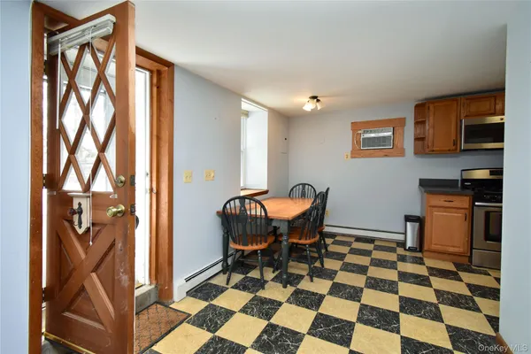 a kitchen with a refrigerator and a sink