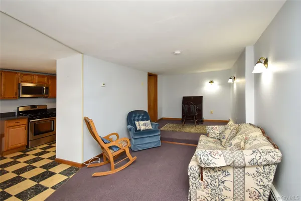 a bedroom with furniture and a wooden floor