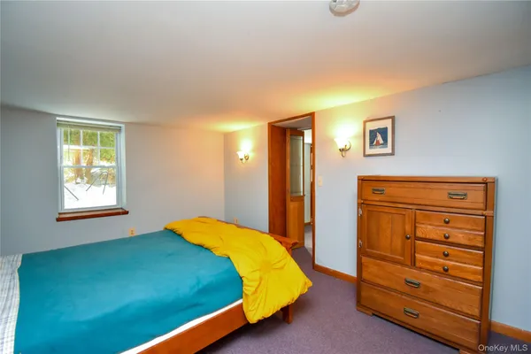 a bedroom with a bed and a closet