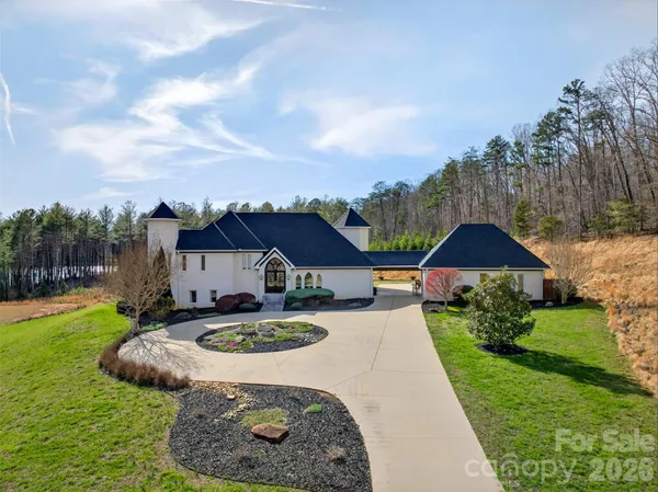 a view of a lake with houses in the back