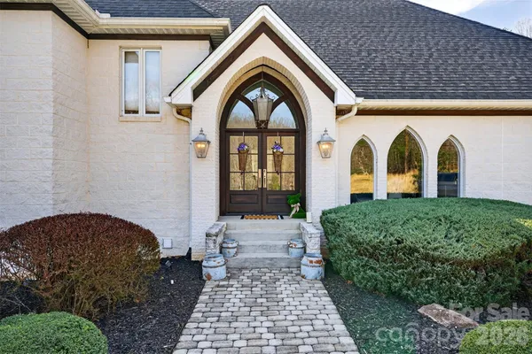 a front view of a house with garden