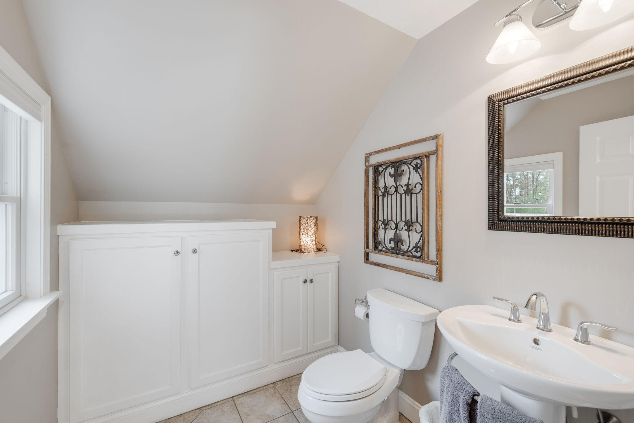 268 Winding Cove Road Marstons Mills, MA 02648 - Photo 15 of 40 a bathroom with a sink a toilet and mirror