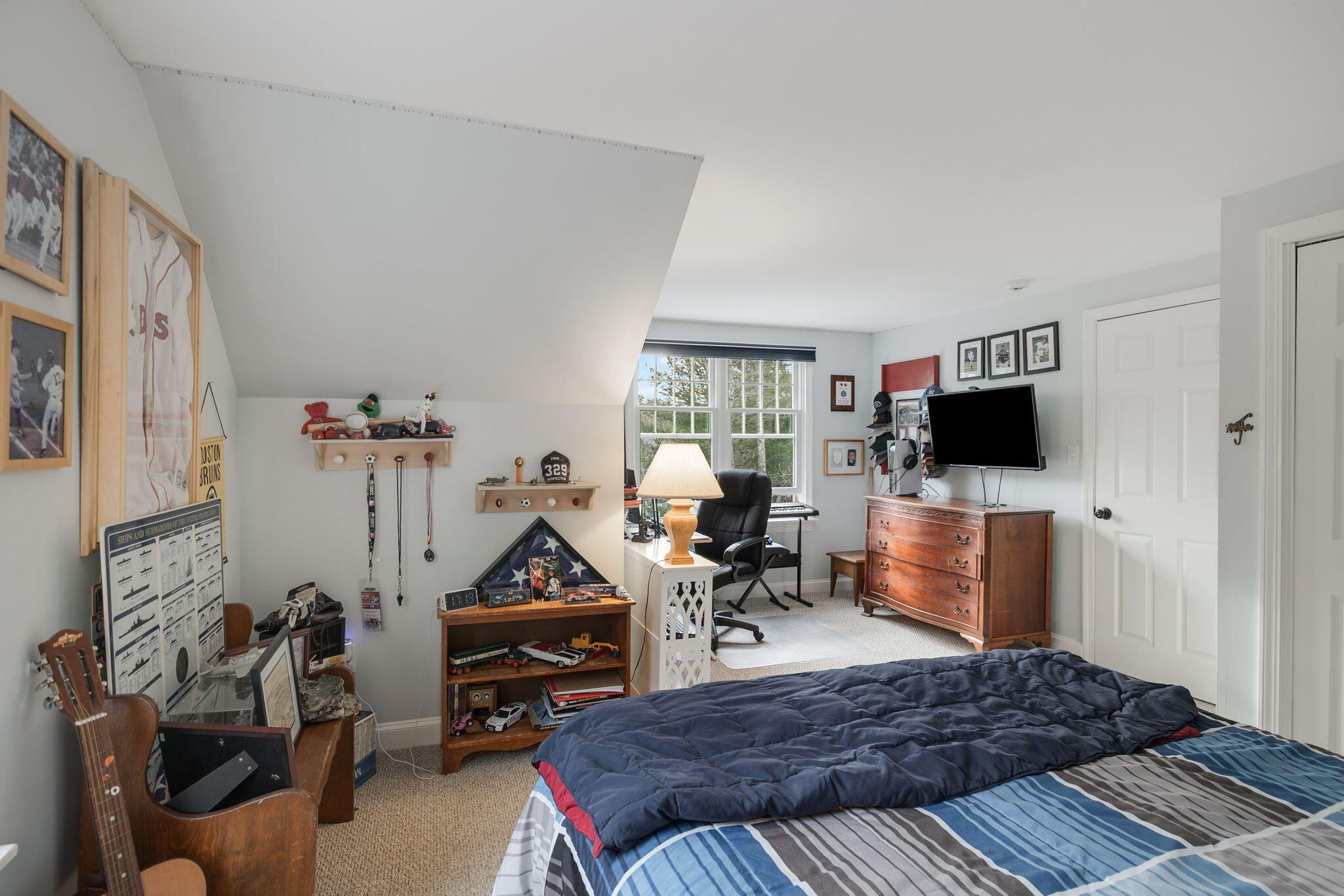 268 Winding Cove Road Marstons Mills, MA 02648 - Photo 23 of 40 a bedroom with furniture and a flat screen tv