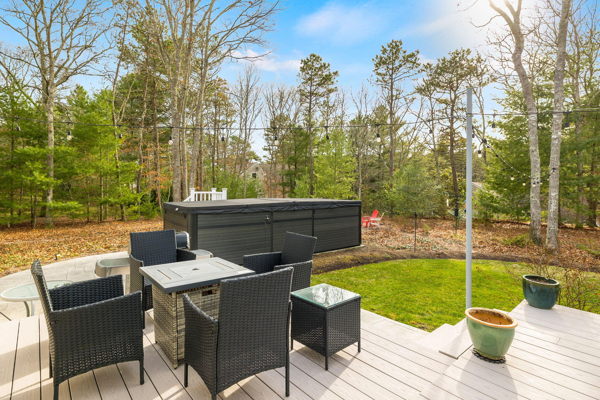 268 Winding Cove Road Marstons Mills, MA 02648 - Photo 27 of 40 a view of a patio with couches chairs and a yard