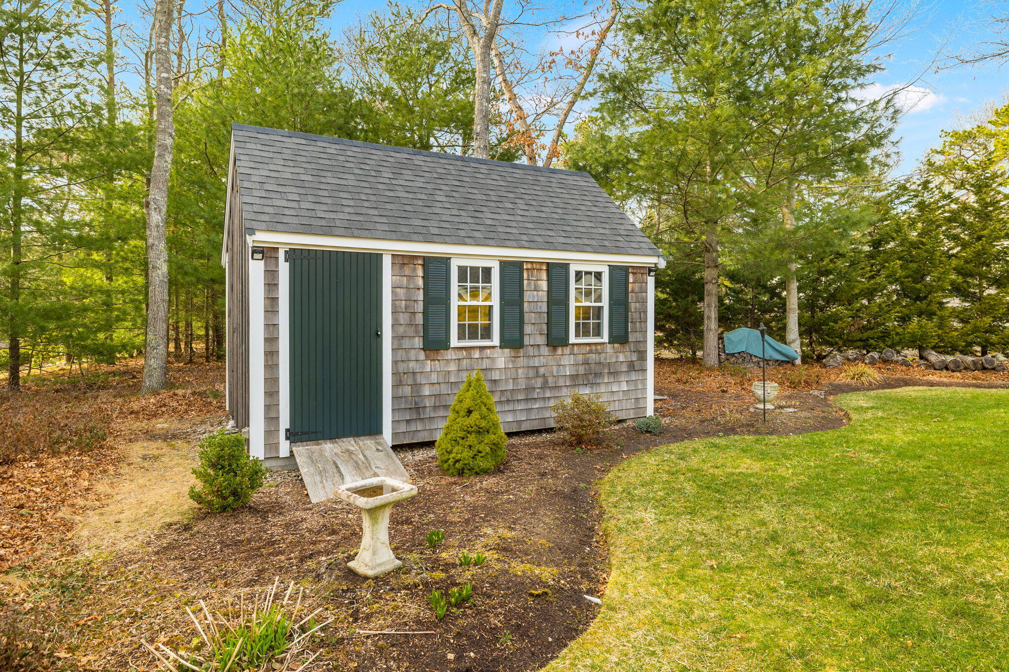 268 Winding Cove Road Marstons Mills, MA 02648 - Photo 29 of 40 a backyard of a house with seating space