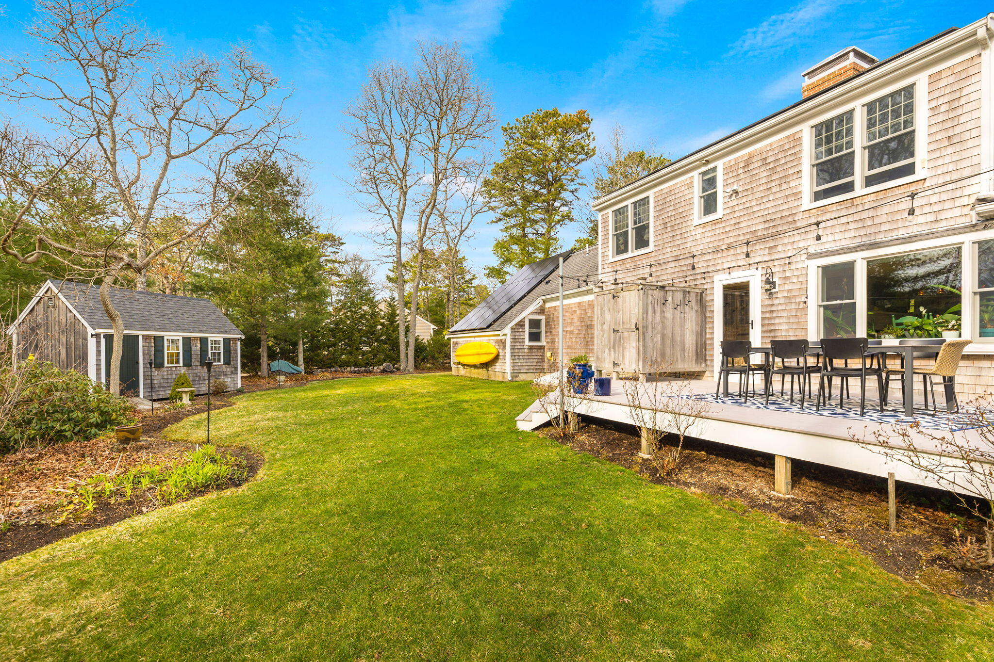 268 Winding Cove Road Marstons Mills, MA 02648 - Photo 30 of 40 a view of a house with a patio