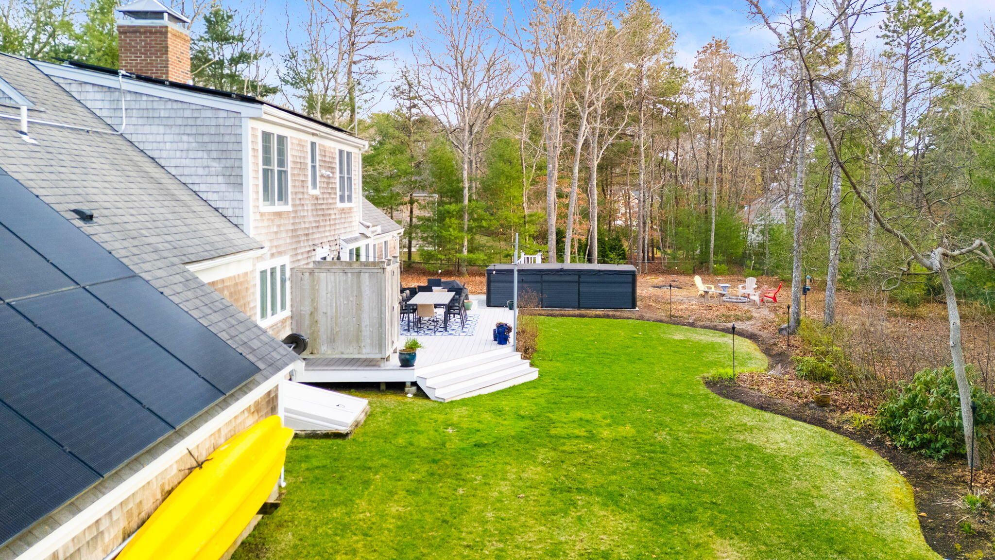 268 Winding Cove Road Marstons Mills, MA 02648 - Photo 32 of 40 a view of a house with backyard and sitting area