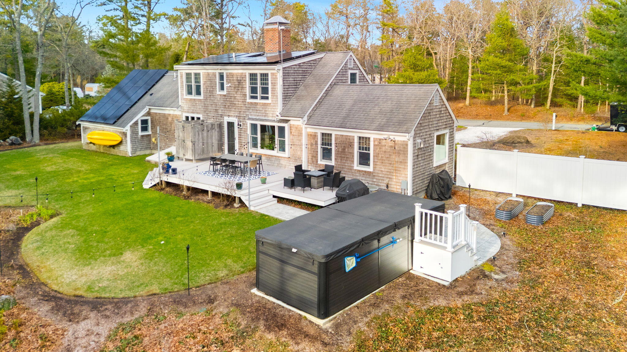 268 Winding Cove Road Marstons Mills, MA 02648 - Photo 33 of 40 a view of a house with backyard and sitting area