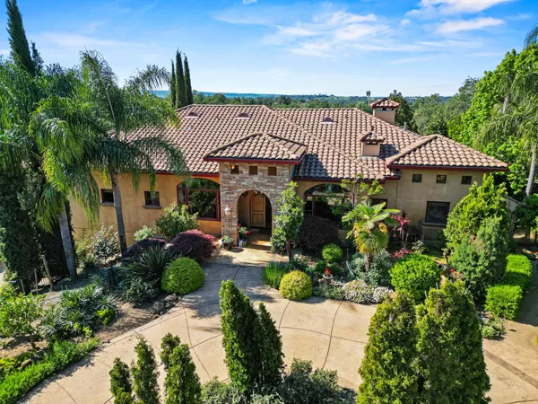 an aerial view of house with yard