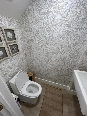 a bathroom with a toilet and a sink
