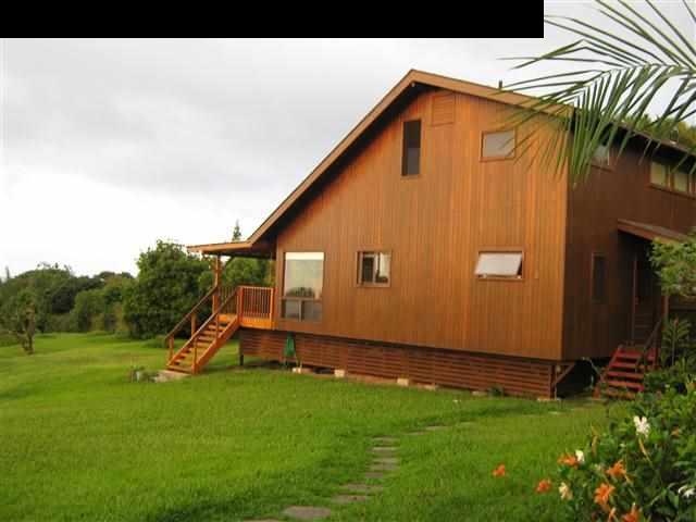 180 Ulaino Road Hana, HI 96713 - Photo 1 of 26 a front view of a house with garden
