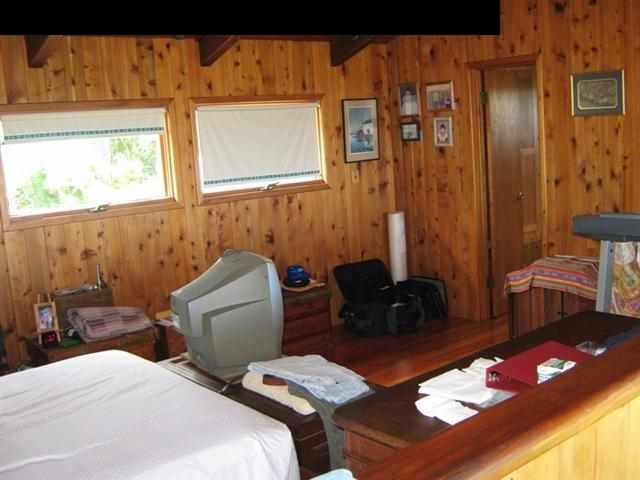 180 Ulaino Road Hana, HI 96713 - Photo 11 of 26 a bedroom with bed and a window