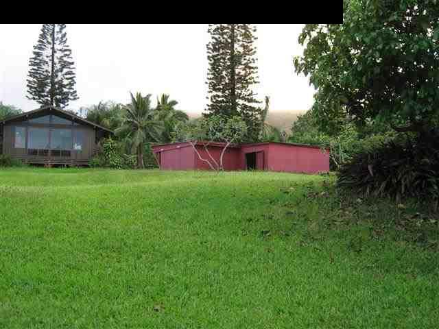 180 Ulaino Road Hana, HI 96713 - Photo 26 of 26 a view of a big house with a big yard and large trees