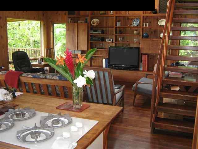 180 Ulaino Road Hana, HI 96713 - Photo 3 of 26 a living room with furniture and a flat screen tv